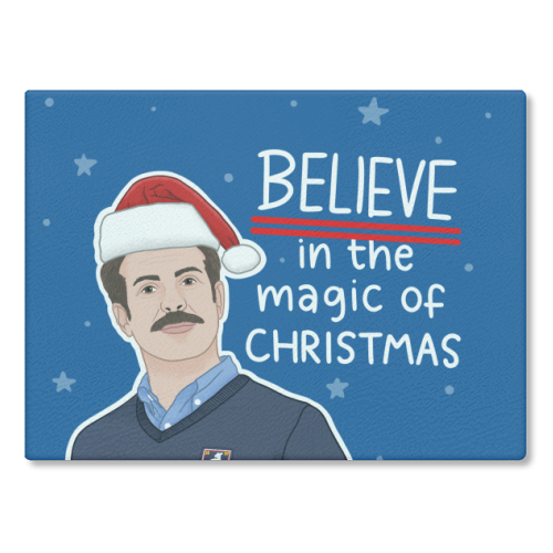 Believe in the magic of Christmas - glass chopping board by Loren Grosvenor
