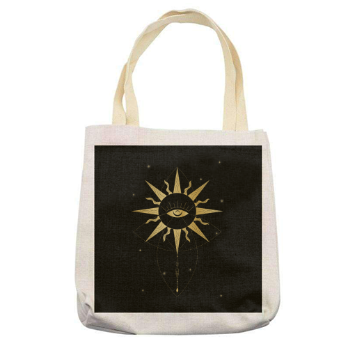 evil eye golden sun - printed canvas tote bag by Anastasios Konstantinidis