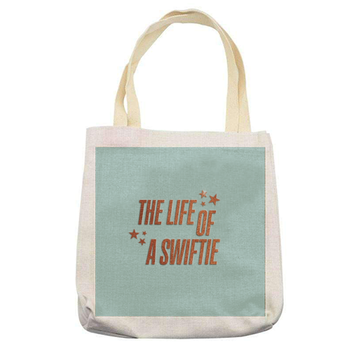 Showgirl The Life Of A Swiftie typography print - printed canvas tote bag by The Girl Next Draw